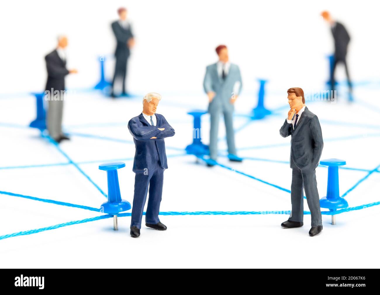 Business connection. Communication between businessmen. Network of threads and office pins. Isolated on white background. Stock Photo