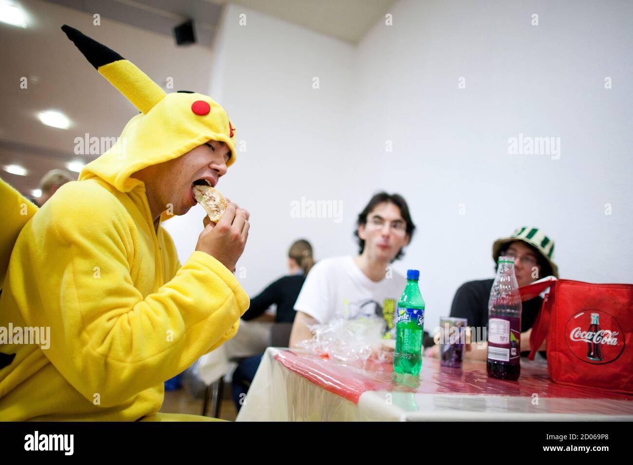 A visitor dressed as Pikachu eats a sandwich at the Polymanga show in  Lausanne, April 23, 2011. Polymanga is the largest manga, anime, video games  and pop culture convention in Switzerland gathering