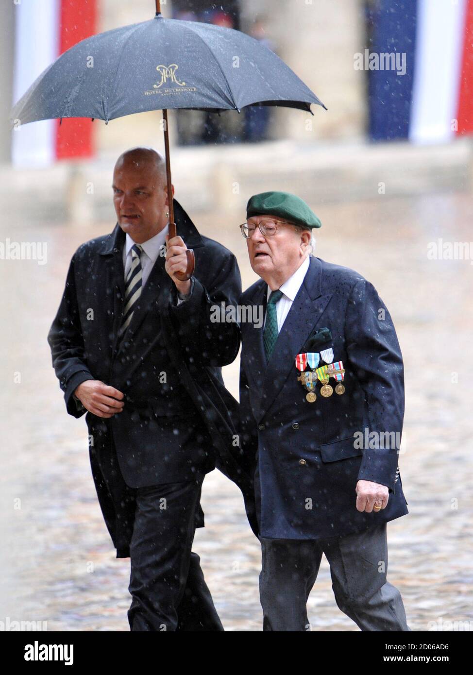 Former French far right Front national party leader Jean-Marie Le Pen (R),  wearing the green beret of Legion etrangere paratroopers, as former  soldier, arrives at the funeral service dedicated to the seven