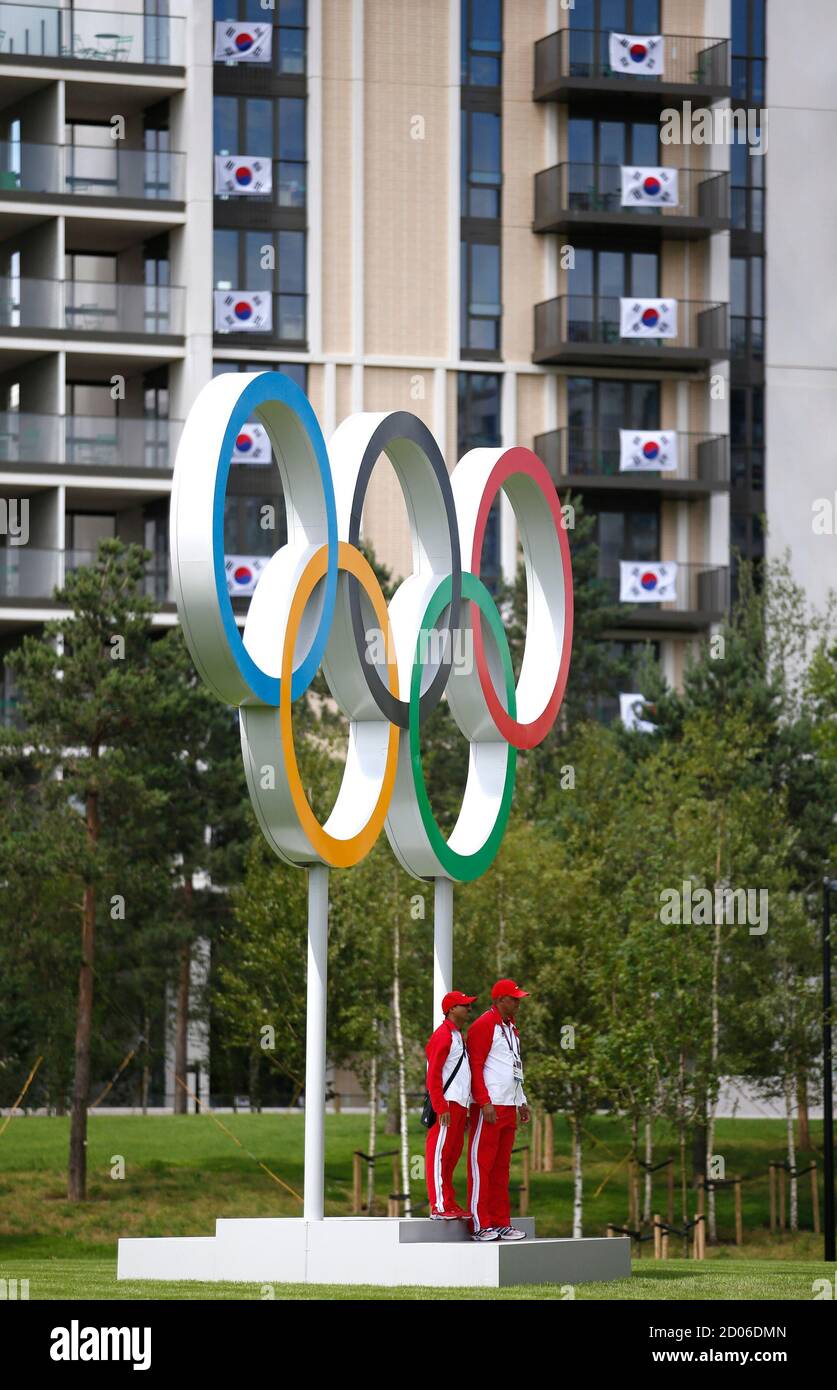 South Korean flags hang from balconies near the Olympic rings at the Athletes' Village at the Olympic Park in London, July 19, 2012.  REUTERS/Jae C. Hong/Pool (BRITAIN - Tags: SPORT OLYMPICS) Stock Photo