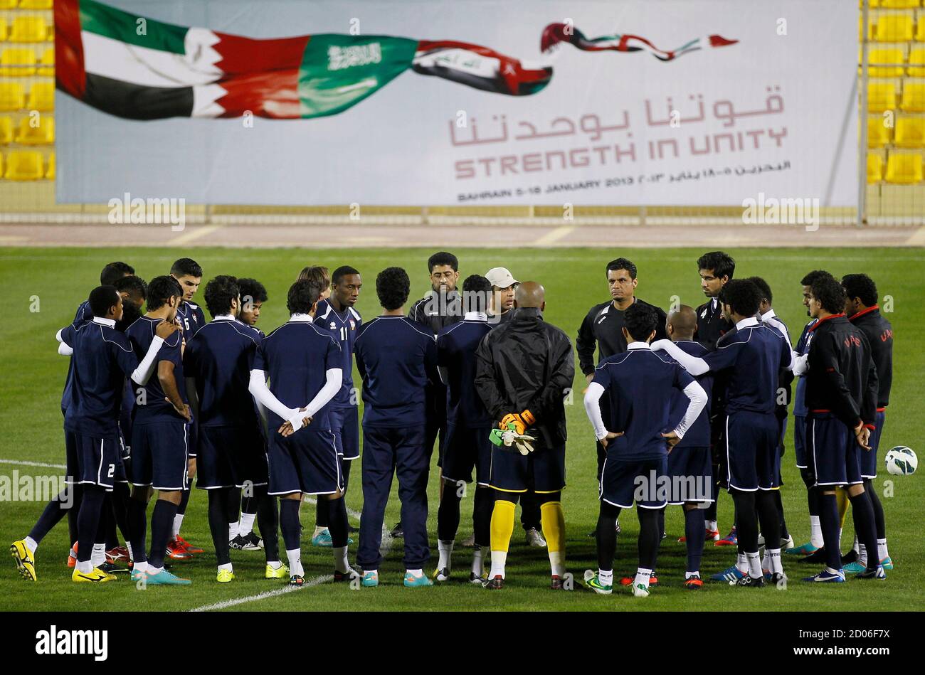 Mahdi Ali (C), coach of United Arab Emirates, speaks to his players during  a training session at Al-Ahli Sports Club in Manama January 4, 2013. UAE  will play against Qatar during the
