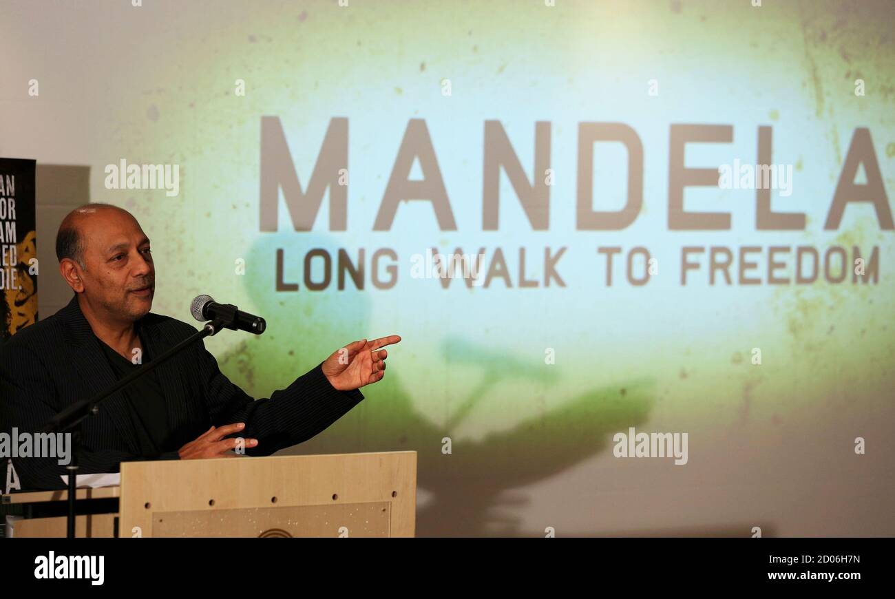 Film producer Anant Singh gestures during the launch of the movie trailer  of "Mandela: Long Walk to Freedom" at the Nelson Mandela Centre of Memory  in Johannesburg, September 17 2013. REUTERS/Siphiwe Sibeko (