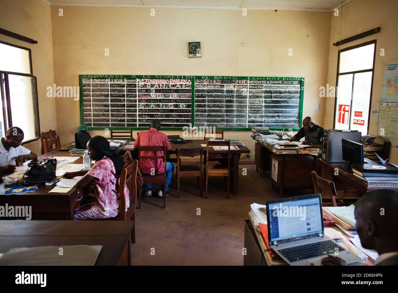 Journalists work in the newsroom of the national radio headquarters in  Bangui, Central African Republic, November 28, 2013. The studio was looted  for its computers and recording equipment during the March 2013