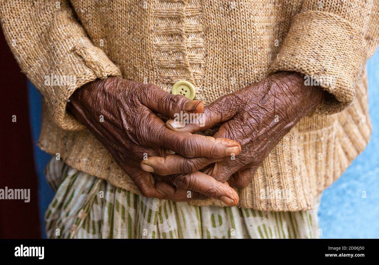 An Old Womans Hands Clasped and Relaxed Close-up. Stock Photo