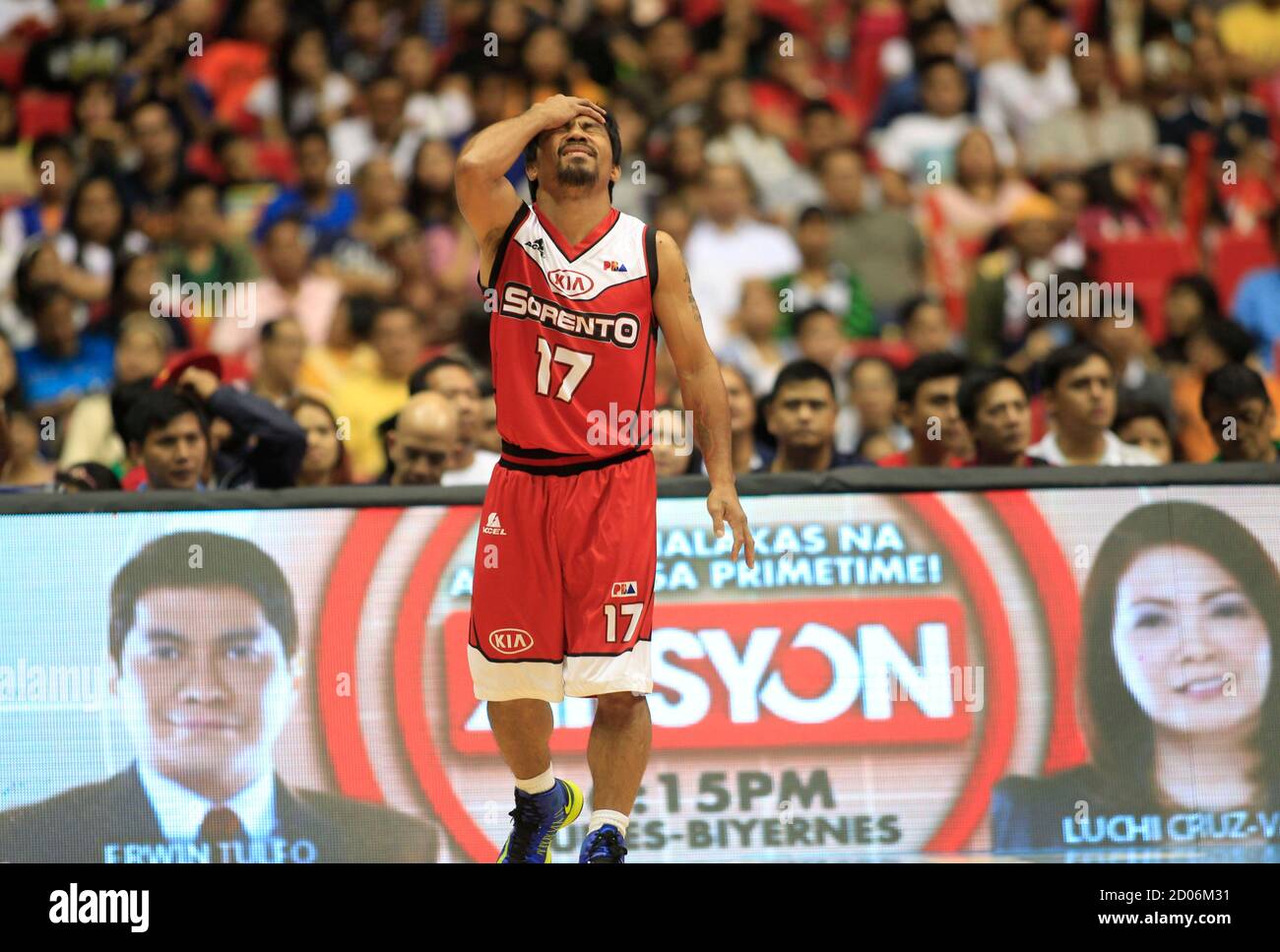 Manny Pacquiao, the playing coach of KIA-Sorento, reacts as he calls for a  foul during the first quarter of a basketball match against the  Blackwater-Elite during the 40th Season of the Philippine