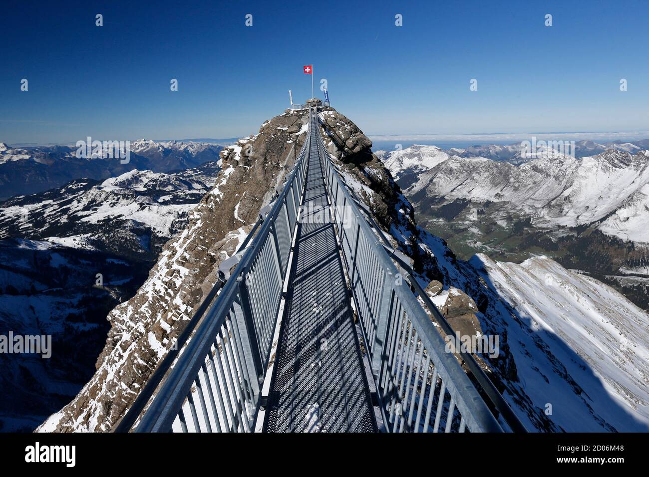 A Swiss national flag flies at one end of the 'Peak Walk' bridge during a  media preview, at the Glacier 3000 in Les Diablerets October 24, 2014.  Built between the Scex Rouge