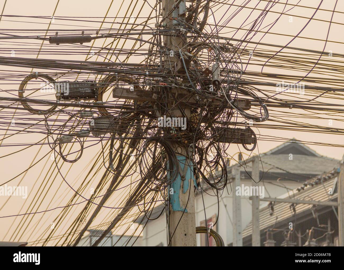 Overhead Power Telephone and Internet Cables Form a Rats Nest. Stock Photo