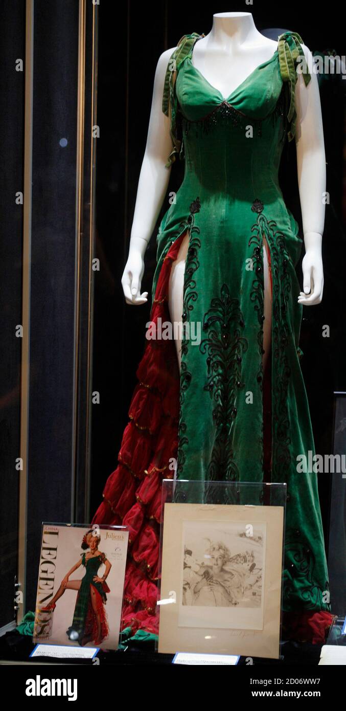 A green velour dress worn by actress Marilyn Monroe in her 1954 film 'River of No Return' is on display at Julien's Auctions in Macau October 22,2011. The dress, which is estimated to fetch $200,000 to $300,00, will be put up for auction on Saturday with other pop memorabilia. REUTERS/Tyrone Siu (CHINA - Tags: ENTERTAINMENT SOCIETY FASHION) Stock Photo