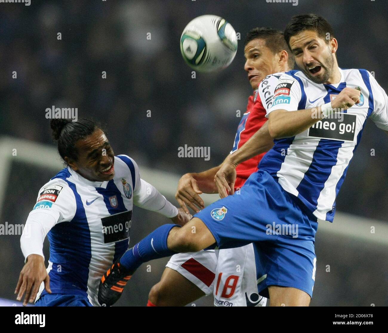 Porto's Joao Moutinho (R) and Alvaro Pereira (L) jump for ...