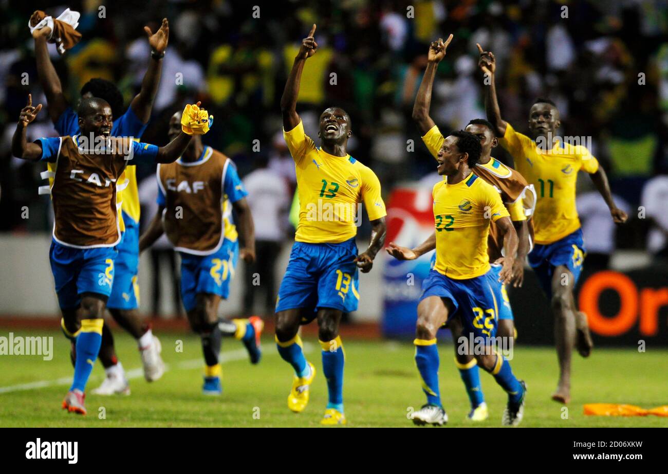 Gabon's Bruno Zita (13) celebrates his goal against Morocco with teammates during their African Cup of Nations Group C soccer match at the Stade De L'Amitie Stadium in Libreville January 27, 2012. REUTERS/Thomas Mukoya (GABON - Tags: SPORT SOCCER TPX IMAGES OF THE DAY) Stock Photo