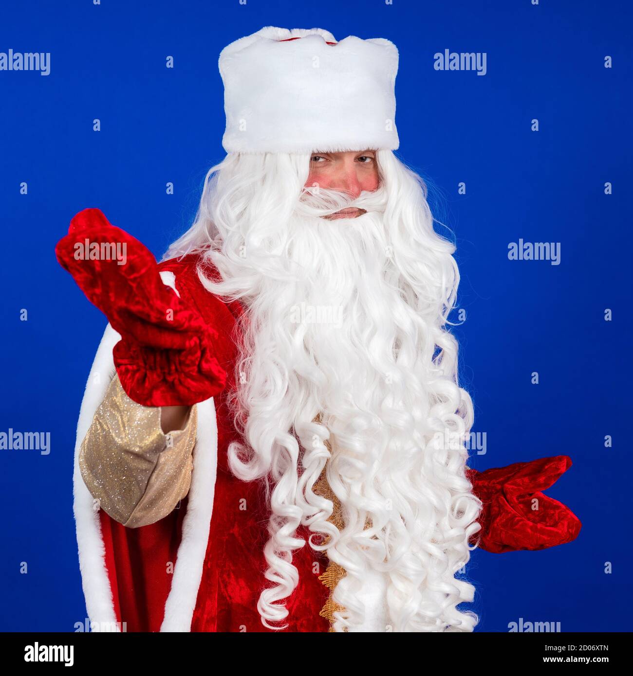 Emotional Santa Claus with a long white beard in a red coat and white ...