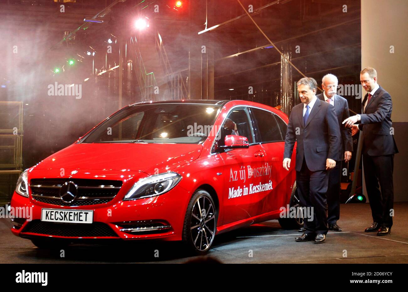 Hungarian Prime Minister Viktor Orban (L) Daimler AG CEO Dieter Zetsche and  Mercedes Benz Manufacturing Hungary Director Frank Klein(R) inspect a new  Mercedes B-class vehicle during the official opening ceremony of the