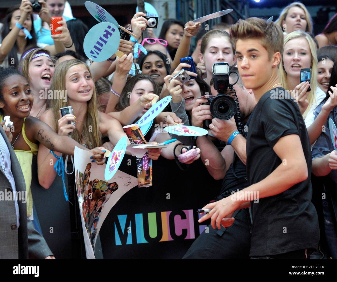 Performer Justin Bieber greets fans on arriving for the MuchMusic Video Awards in Toronto, June 17, 2012. REUTERS/Mike (CANADA - Tags: ENTERTAINMENT Stock Photo - Alamy