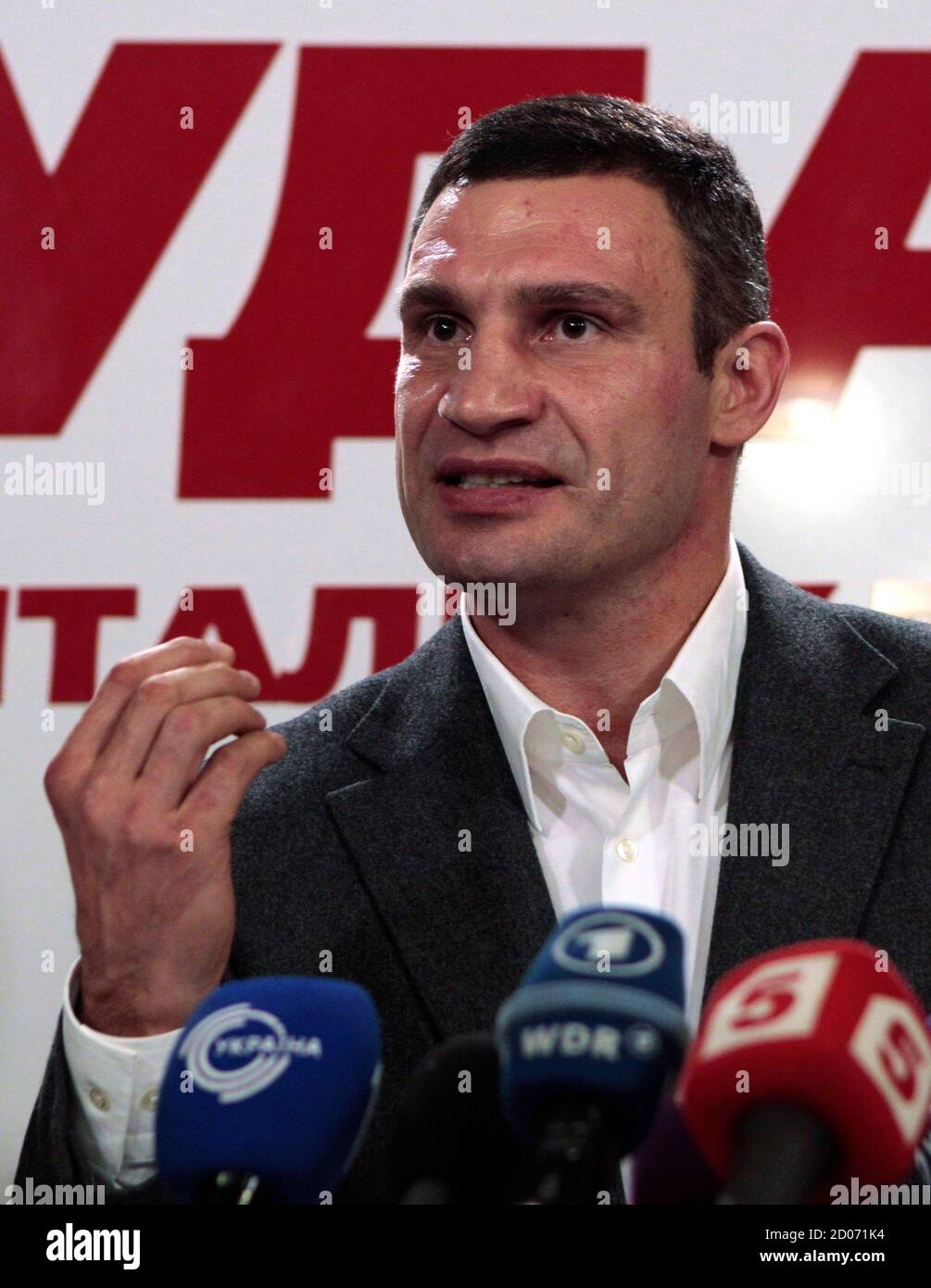 Heavyweight boxing champion and UDAR (Punch) party leader Vitaly Klitschko speaks at his party's election headquarters in Kiev, October 28, 2012. Ukrainian President Viktor Yanukovich's pro-business ruling party led in a national election on Sunday and seemed likely to keep its majority in parliament, exit polls showed, despite a strong showing by the combined opposition.  REUTERS/Vasily Fedosenko (UKRAINE - Tags: SPORT BOXING POLITICS ELECTIONS) Stock Photo