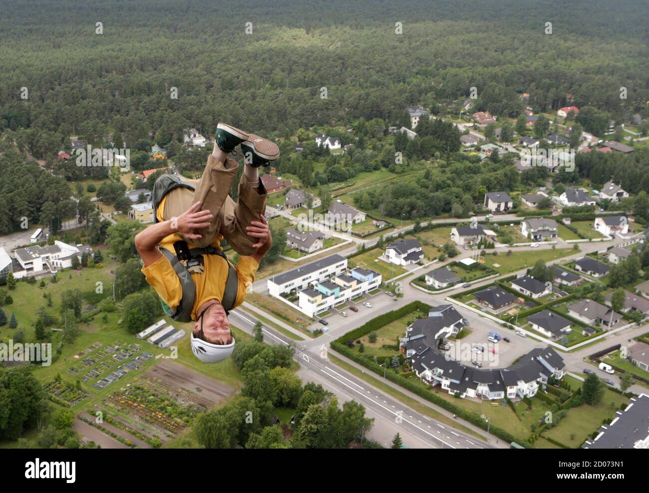 BASE jumper Konstantin Yaemurd of Russia leaps before opening his parachute during Tallinn TV Tower B.A.S.E. Boogie 2013 event July 11, 2013. More than 60 BASE jumpers from fourteen countries are taking part in this annual event. REUTERS/Ints Kalnins (ESTONIA - Tags: SPORT SOCIETY) Stock Photo