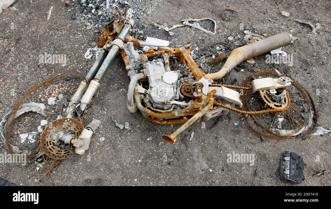 The remains of a motorcycle lie on the ground on Courtney Drive in Colorado Springs, Colorado September 17, 2012.  The Waldo Canyon fire destroyed 346 homes on June 26, 2012. Picture taken September 17, 2012. REUTERS/Rick Wilking (UNITED STATES - Tags: ANNIVERSARY DISASTER SOCIETY) Stock Photo