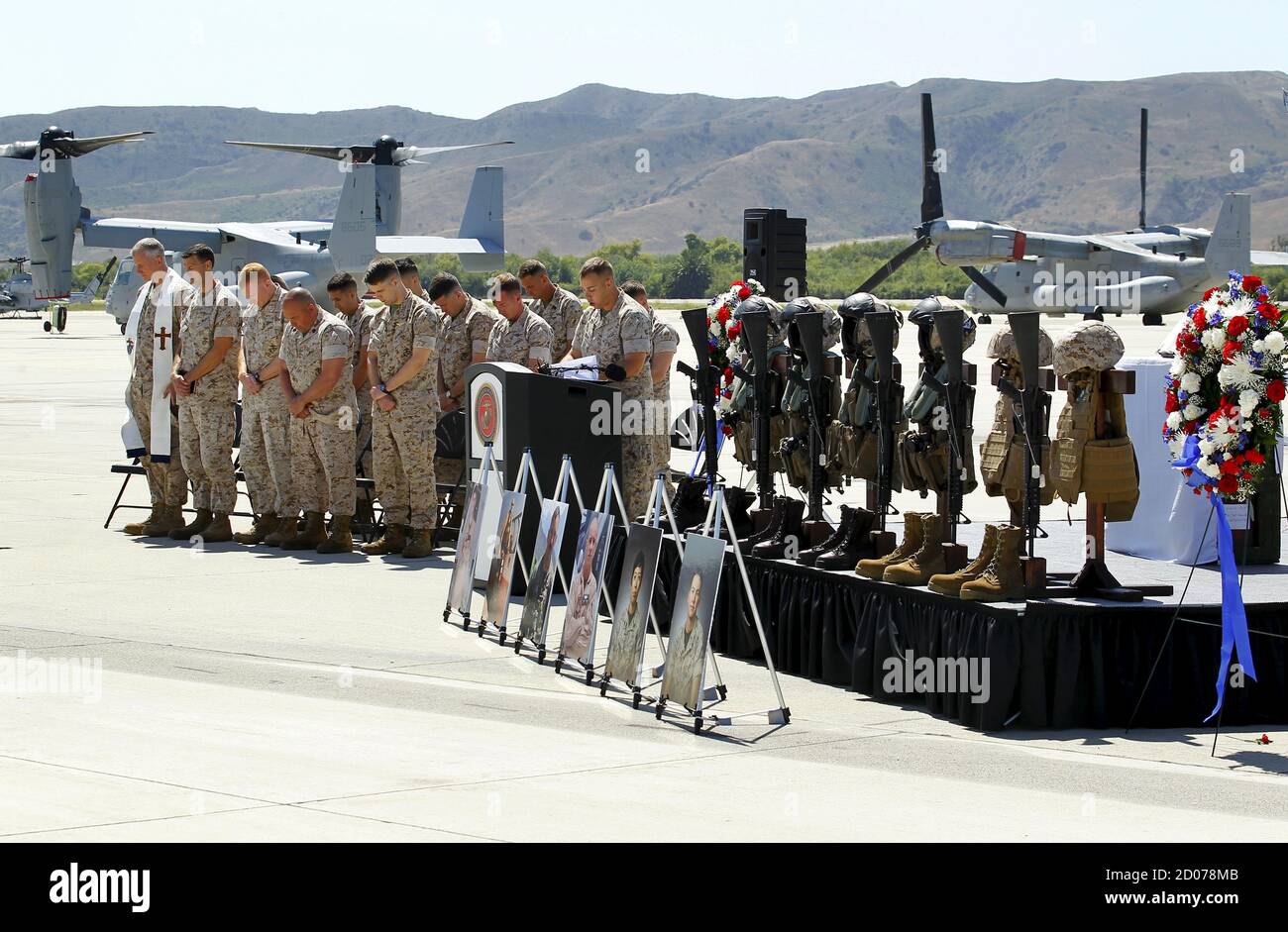 A moment of silence is given to marines from the 3rd Marine Aircraft Wing, who lost their lives in the crash of their military helicopter while coming to the aid of earthquake victims in Nepal, during a memorial service at Camp Pendleton, California June 3, 2015. REUTERS/Mike Blake Stock Photo