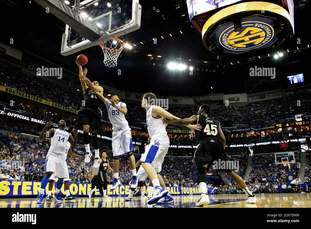 Vanderbilt Commodores forward Jeffery Taylor (front 2nd L) shoots over  Kentucky Wildcats forward Anthony Davis (front C) during the final of the  SEC men's NCAA basketball tournament in New Orleans, Louisiana March