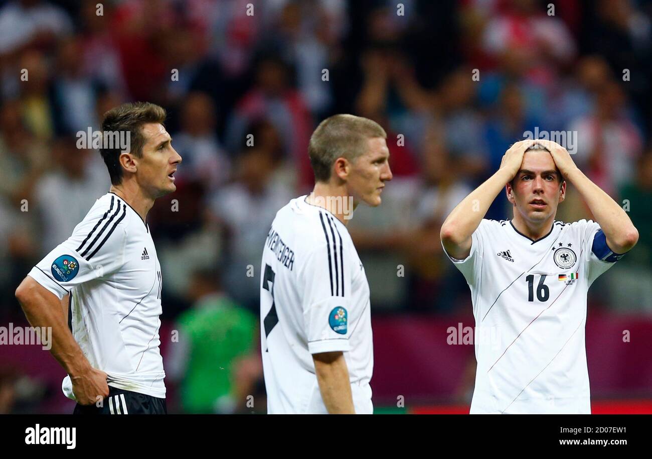 Germany S Miroslav Klose L Bastian Schweinsteiger C And Philipp Lahm React After The Euro 2012 Semi Final Soccer Match Against Italy At National Stadium In Warsaw June 28 2012 Reuters Kai Pfaffenbach Poland