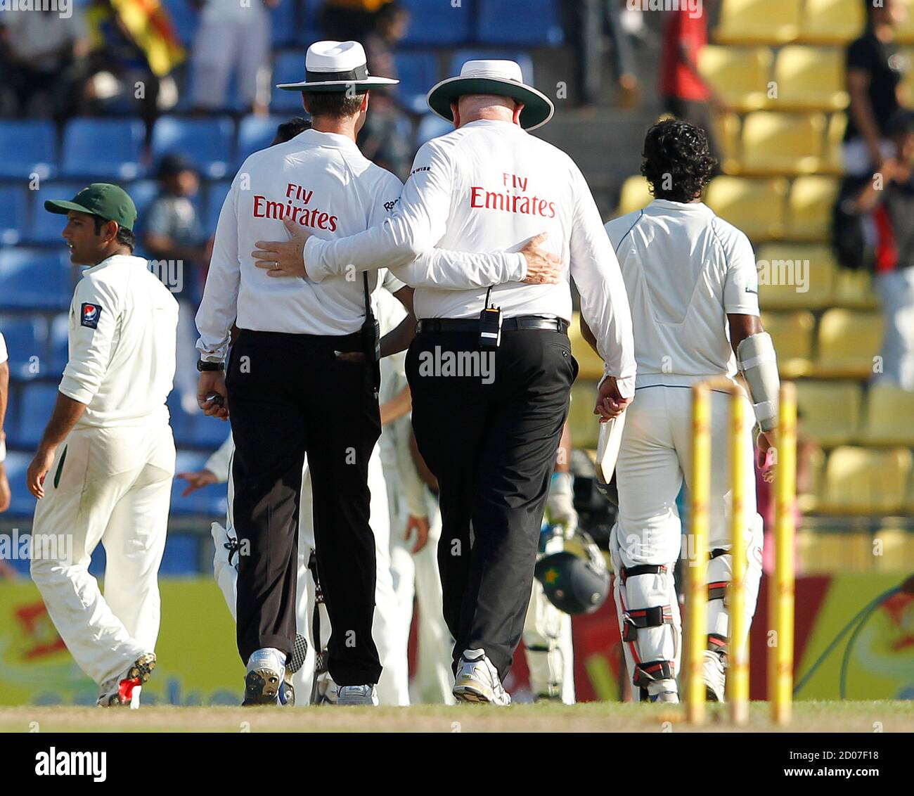 Umpires Simon Taufel (L) and Stephen Davis (R) walks off the field at the end of the final test match between Sri Lanka and Pakistan, in Pallekele July 12, 2012. REUTERS/Dinuka Liyanawatte (SRI LANKA - Tags: SPORT CRICKET) Stock Photo