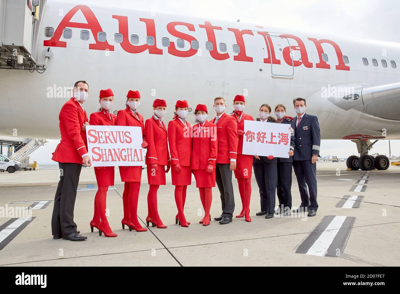 Vienna, Austria. 2nd Oct, 2020. Crew of Austrian Airlines' first resumed passenger flight to Shanghai pose for a group photo at the Vienna International Airport in Schwechat, Austria, on Oct. 2, 2020. Austrian Airlines resumed passenger flights to Shanghai on Friday, which were suspended due to the COVID-19 pandemic. Credit: Georges Schneider/Xinhua/Alamy Live News Stock Photo