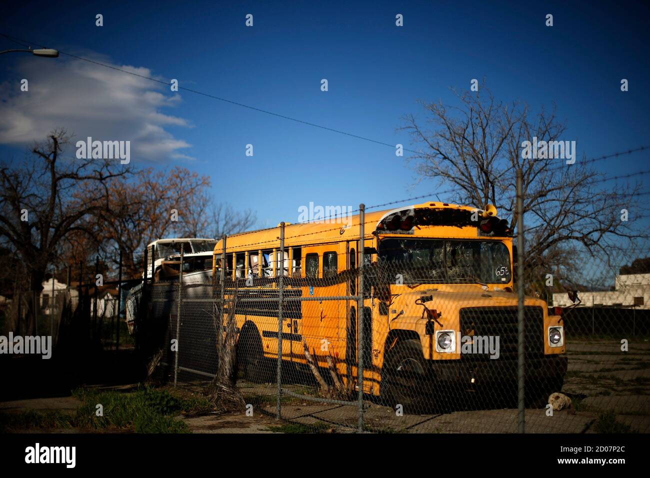 A derelict school bus is seen in San Bernardino, California January 23, 2015. Bankrupt San Bernardino will significantly impair its bondholder creditors while paying pension fund Calpers in full in a plan to be presented in May, City Attorney Gary Saenz said on Thursday. San Bernardino has also not held any talks with its capital market creditors since September and has no immediate plans to do so before it presents its bankruptcy exit plan by a court-ordered date of May 30th, Saenz said.  REUTERS/Lucy Nicholson (UNITED STATES - Tags: BUSINESS POLITICS) Stock Photo