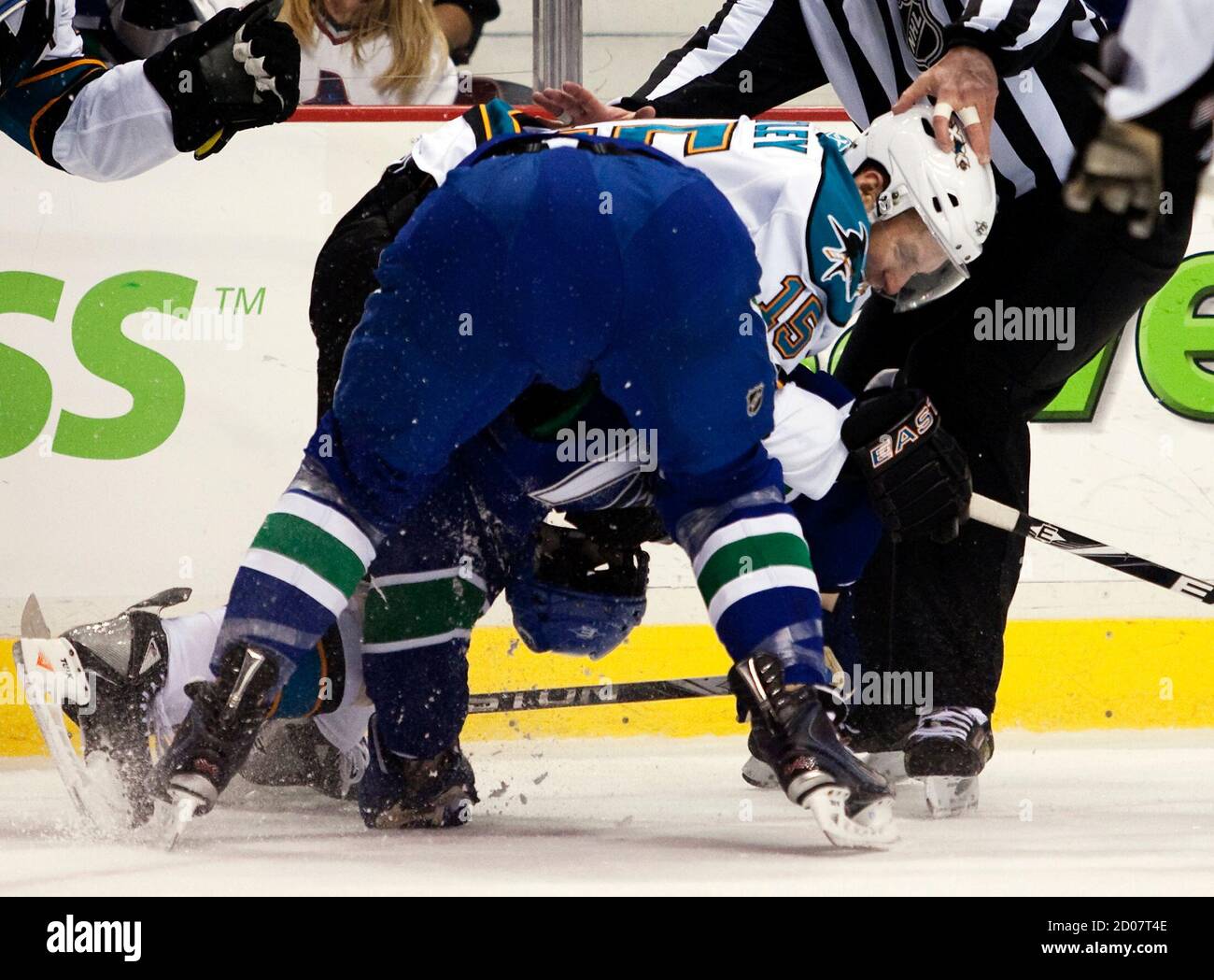 Vancouver Canucks Raffi Torres (blue) is roughed up by San Jose Sharks Dany Heatley during the first period of their NHL hockey game in Vancouver, British Columbia January 20, 2011.  REUTERS/Ben Nelms  (CANADA - Tags: SPORT ICE HOCKEY) Stock Photo