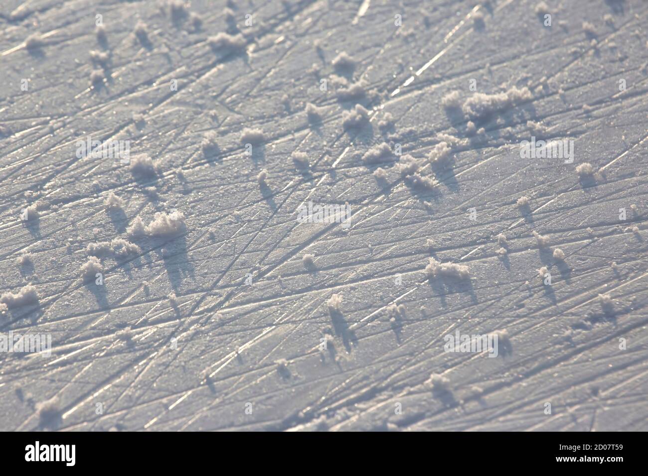 bright traces of ice skating on an ice rink. background and texture Stock Photo