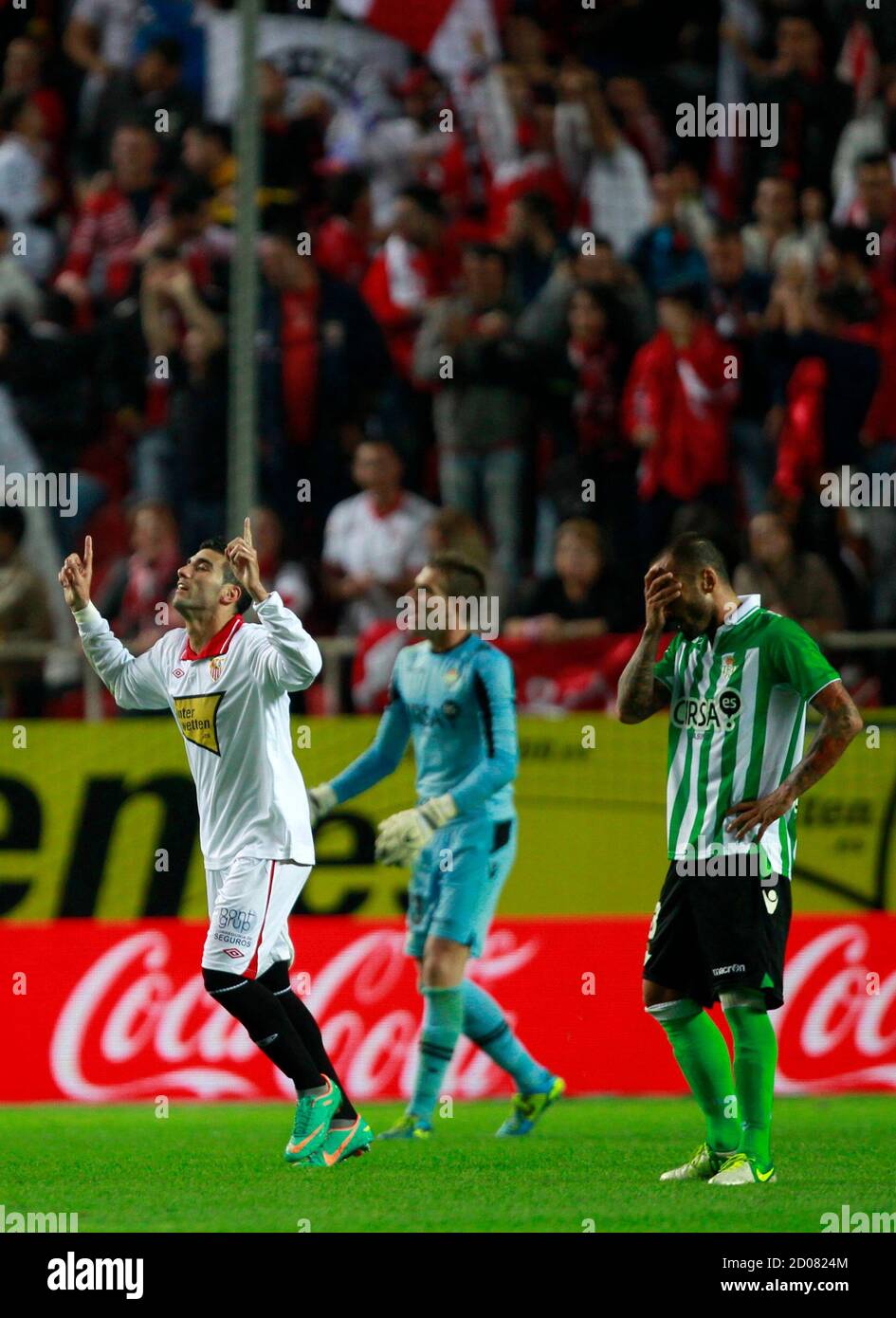 Sevilla's Jose Antonio Reyes (L) celebrates after scoring against Real Betis  during their Spanish First Division soccer match at Ramon Sanchez Pizjuan  stadium in Seville November 18, 2012. REUTERS/Marcelo del Pozo (SPAIN -