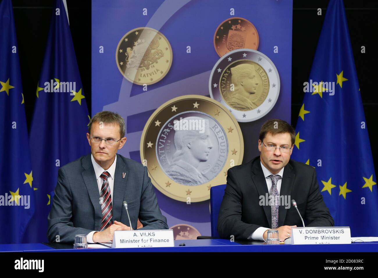 Latvia's Prime Minister Valdis Dombrovskis and Finance Minister Andris Vilks (L) address a news conference on the adoption of the euro by Latvia at the European Union council building in Brussels July 9, 2013. The euro zone embraced tiny Latvia as its newest member on Tuesday, eager to show that the bloc is not disintegrating while doubts remain about southern Europe's ability to overcome more than three years of crisis.   REUTERS/Francois Lenoir (BELGIUM - Tags: POLITICS BUSINESS) Stock Photo