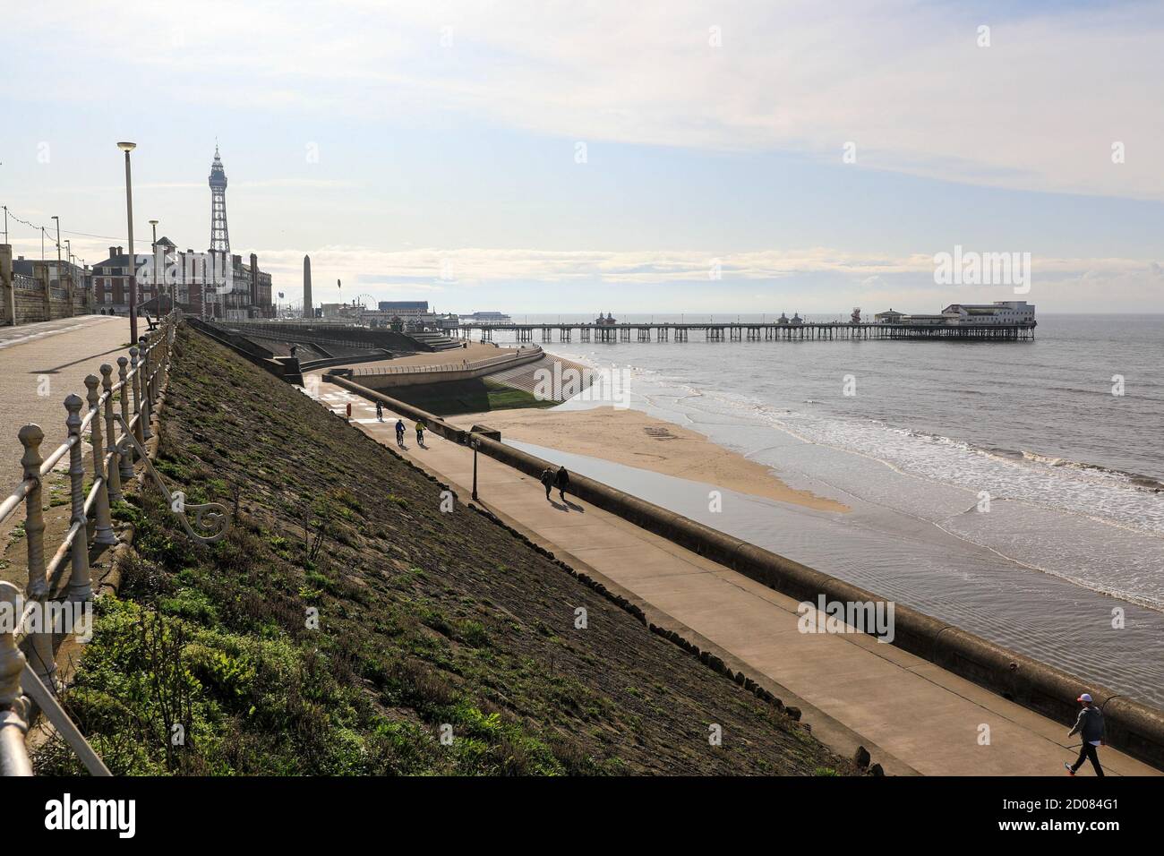 Promenade on the seafront with the Tower and North Pier in the background at Blackpool, Lancashire, England, UK Stock Photo