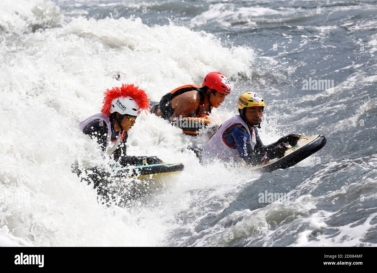 Indonesia's riverboarders ride the waves during the first Riverboarding  World Championship 2013 at Citarum river on