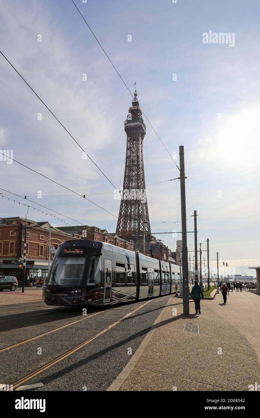 A tram on the Promenade and Blackpool Tower on the seafront at Blackpool, Lancashire, England, UK Stock Photo