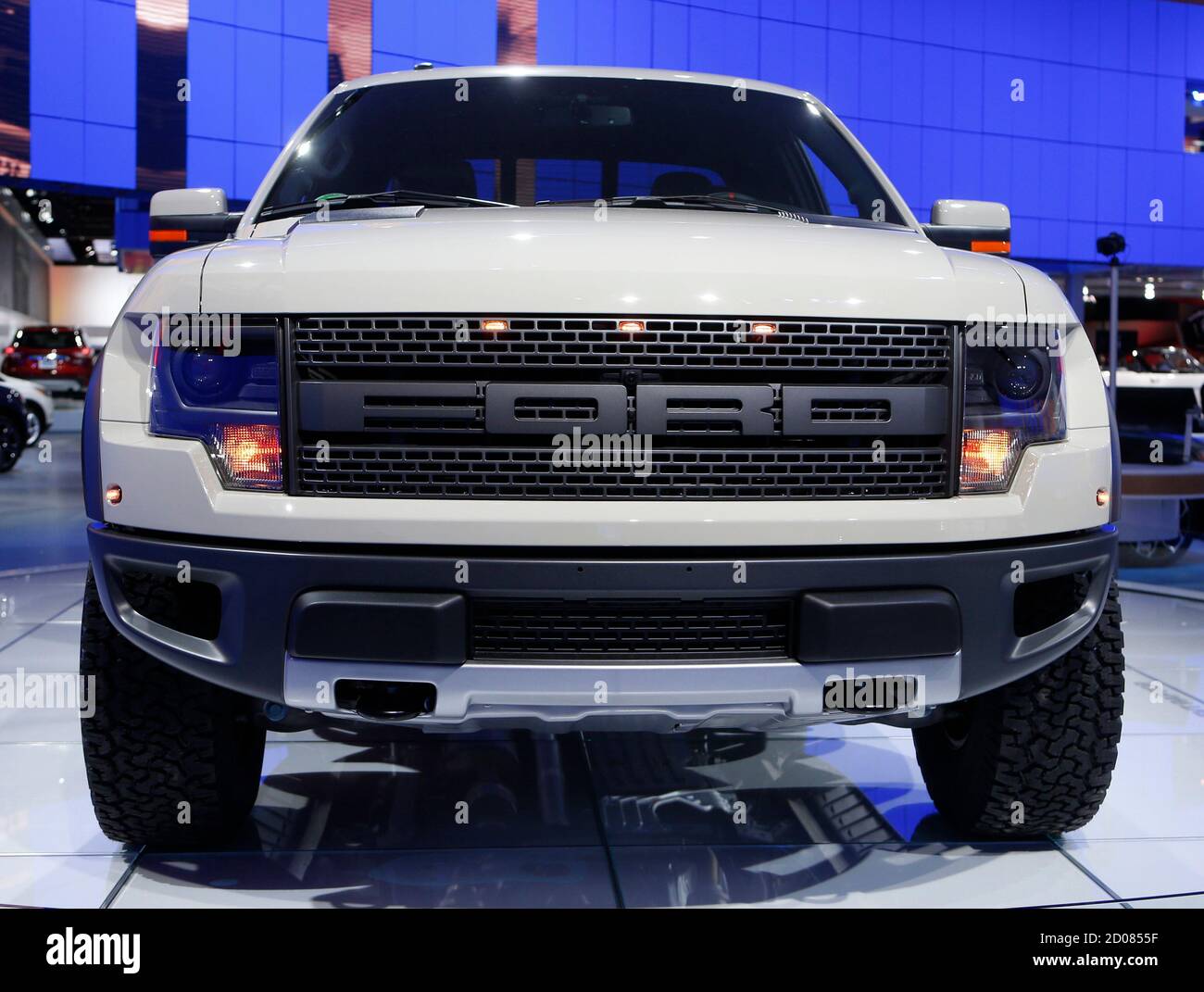 View of the grille and headlights of a 2014 Ford SVT Raptor on display during the press preview day of the North American International Auto Show in Detroit, Michigan January 14, 2014. REUTERS/Rebecca Cook (UNITED STATES  - Tags: TRANSPORT BUSINESS) Stock Photo