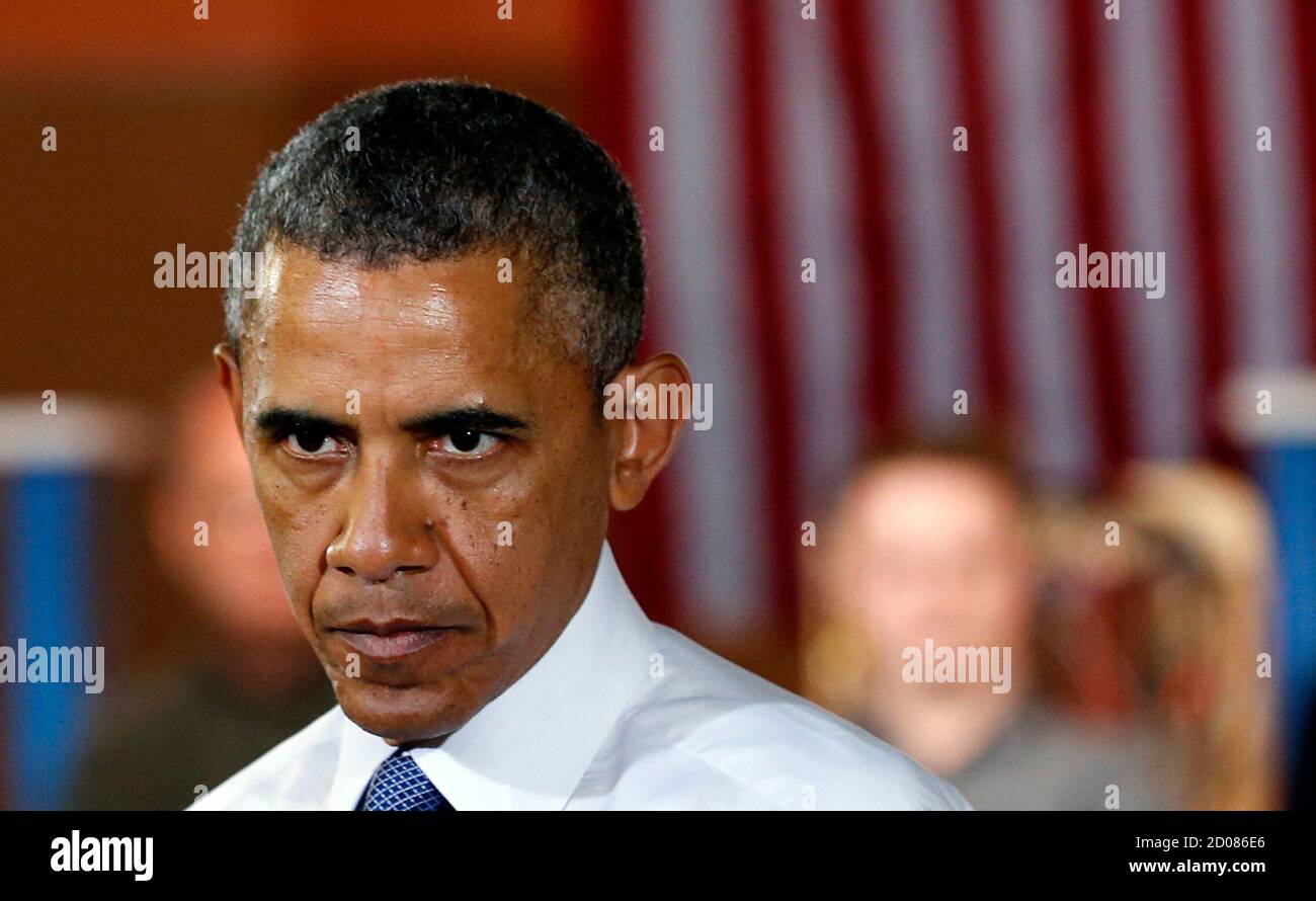 U.S. President Barack Obama listens to a question during a visit to Pittsburgh June 17,  2014. During the event, Obama said that Ahmed Abu Khatallah, the suspected ringleader of the 2012 attack on the U.S. diplomatic compound in Benghazi, Libya, was being transported to the United States after his capture on Sunday.  REUTERS/Kevin Lamarque  (UNITED STATES - Tags: POLITICS) Stock Photo