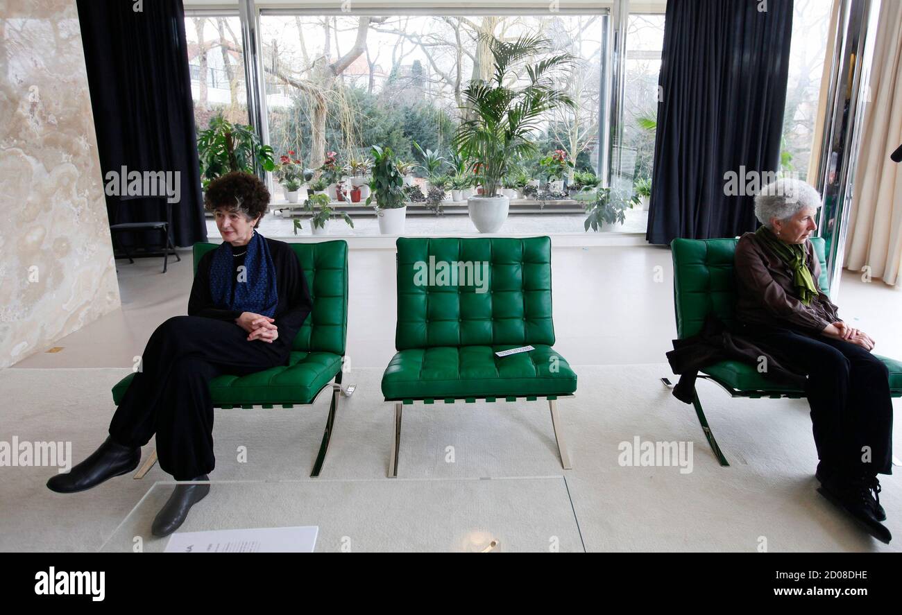 Daniela Hammer-Tugendhat and her sister Ruth Guggenheim-Tugendhat (R) sit  in a living room of Tugendhat villa during its presentation to the media in  Brno February 29, 2012. Ludwig Mies van der Rohe's