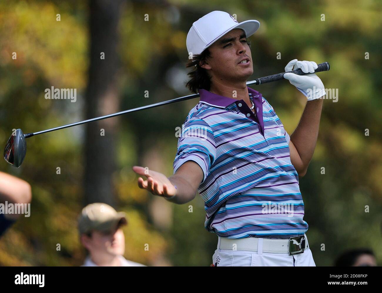Rickie Fowler of the U.S. reacts to his drive on the 14th hole during the  third round of the Tour Championship golf tournament at the East Lake Golf  Club in Atlanta, Georgia