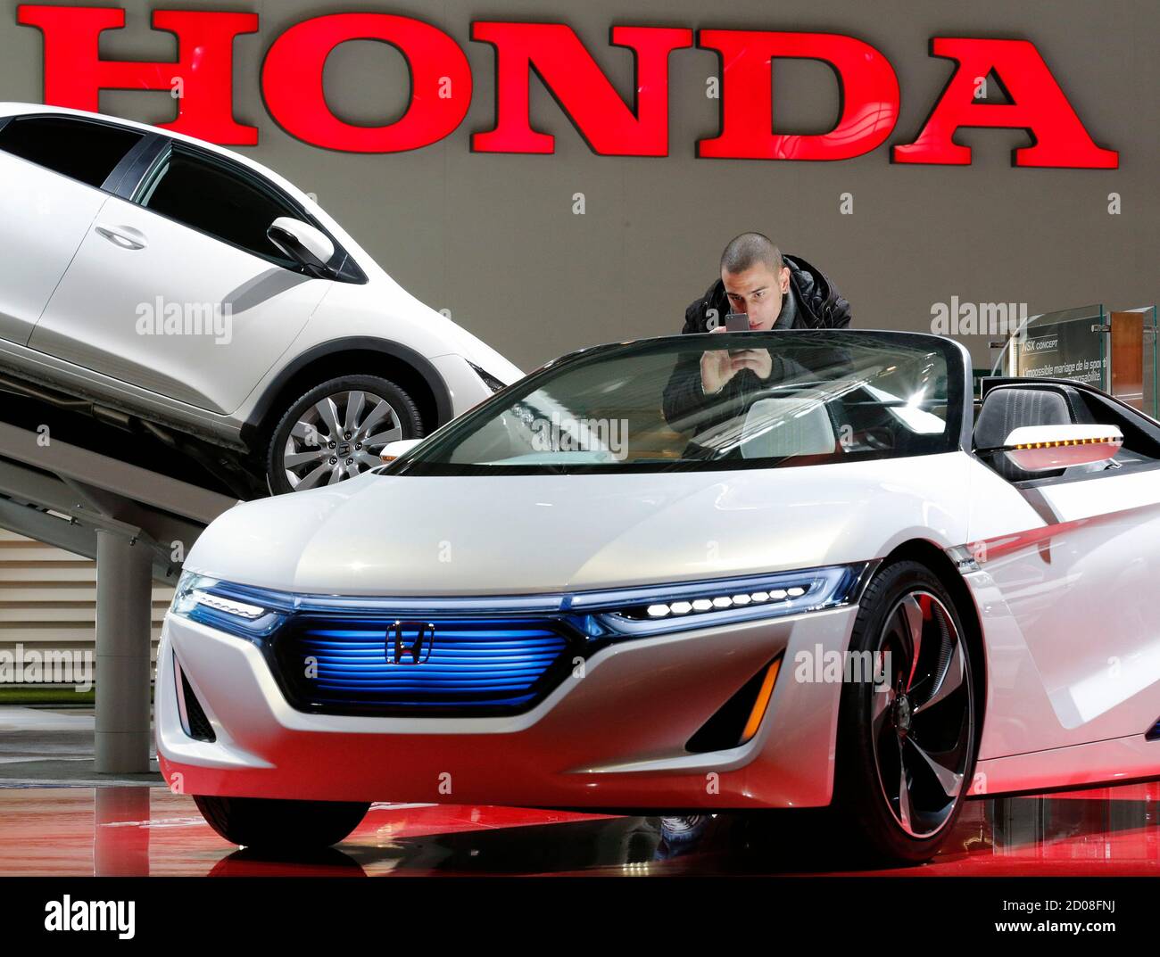 A Visitor Takes Pictures Of A Honda Ev Ster Concept Car Displayed On Media Day At The Paris Mondial De L Automobile September 28 12 The Paris Auto Show Opens Its Doors To The A Visitor Takes Pictures Of A Honda Ev Ster Concept Car Displayed On Media Day At The Paris Mondial De L Automobile September 28 12 The Paris Auto Show Opens Its Doors To The