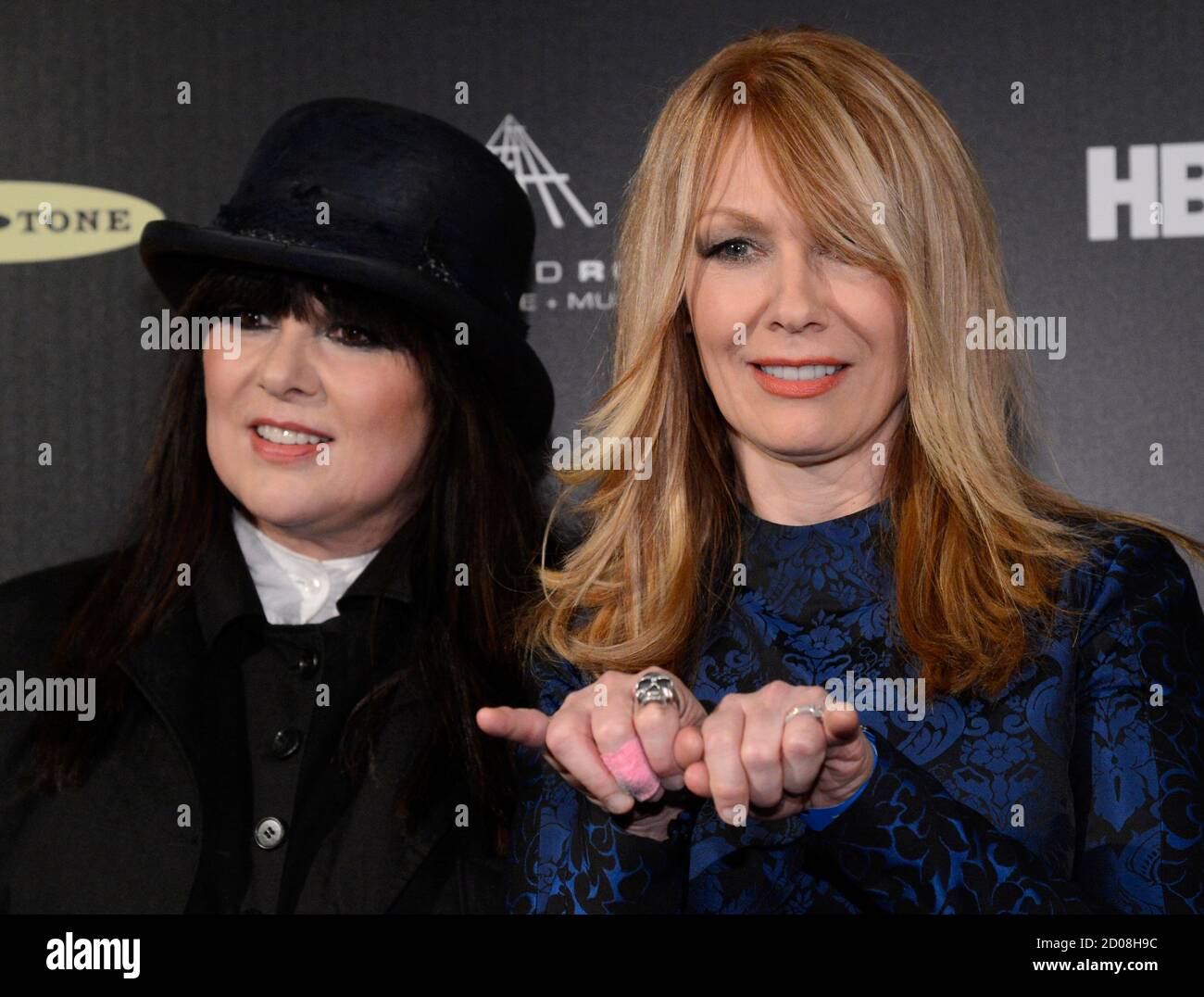 Ann (L) and Nancy Wilson, of Heart, stand backstage at the 2013 Rock and Roll  Hall