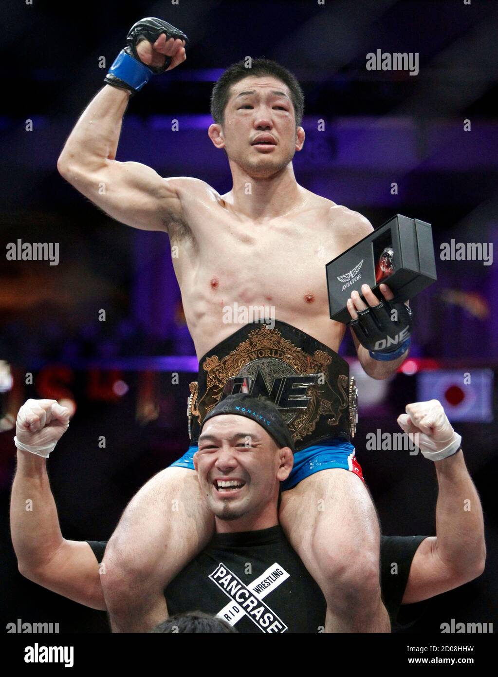 Japanese lightweight King of Pancrase Koji Oishi celebrates after his fight  with ONE Fighting Championship (FC) featherweight world champion Honorio  Banario of the Philippines during the ONE FC mixed martial arts (MMA)