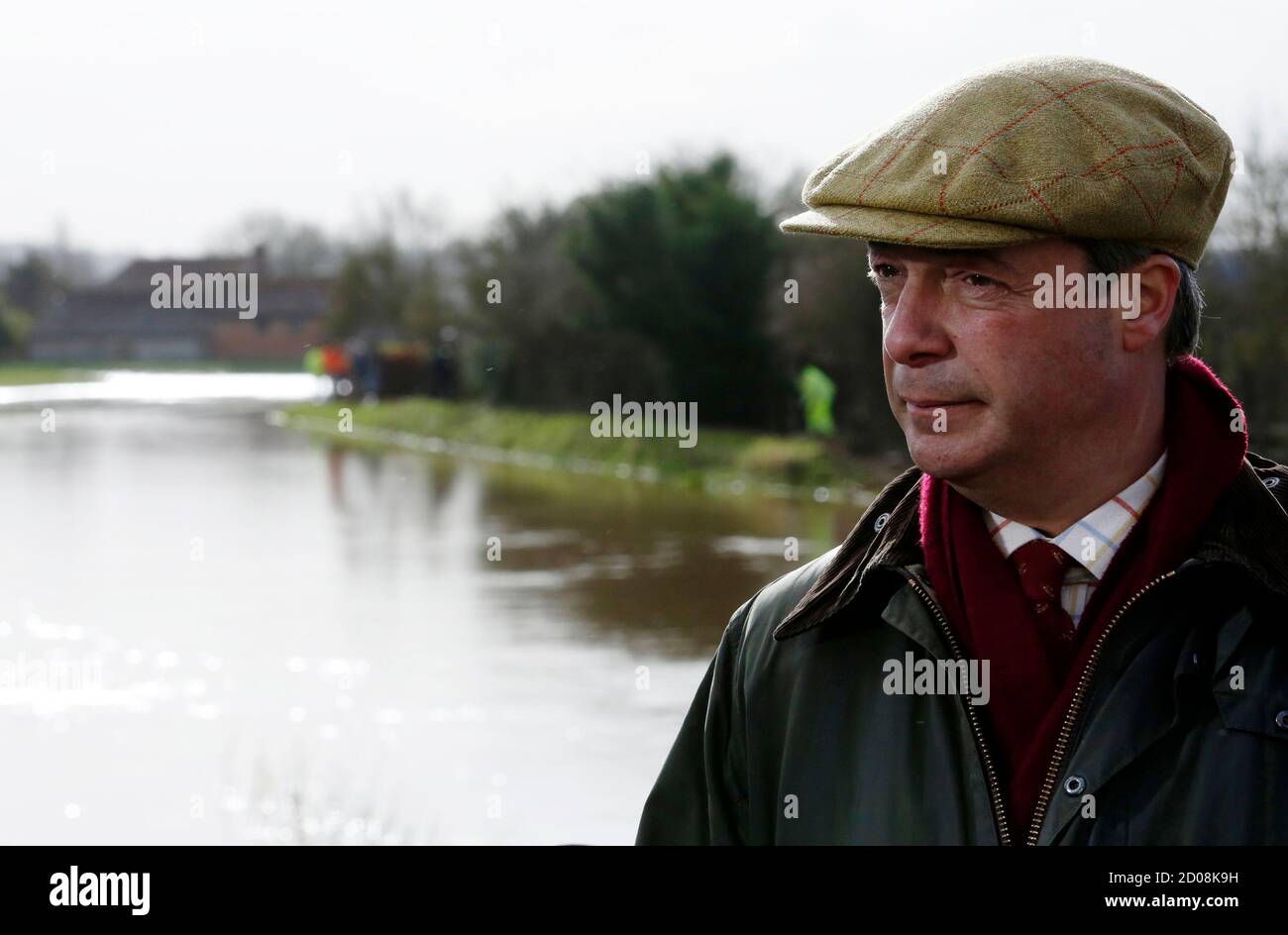UK Independence Party leader Nigel Farage visits the village of Burrowbridge during continued flooding in Somerset, south west England February 9, 2014. REUTERS/Luke MacGregor (BRITAIN - Tags: ENVIRONMENT DISASTER POLITICS) Stock Photo