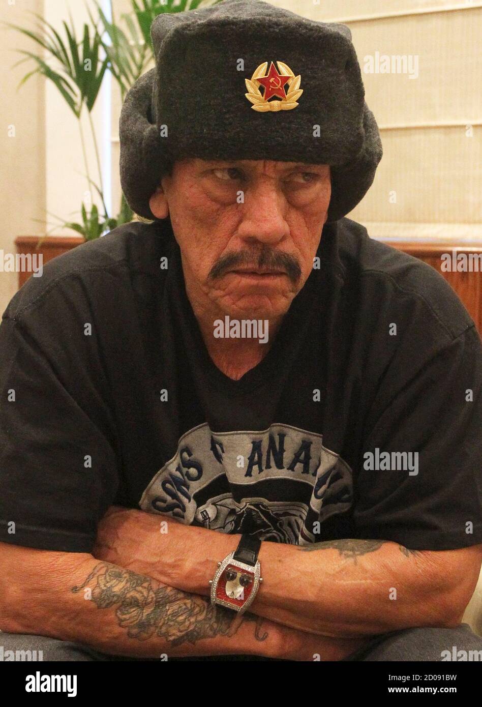 Actor Danny Trejo wearing a hat with a 