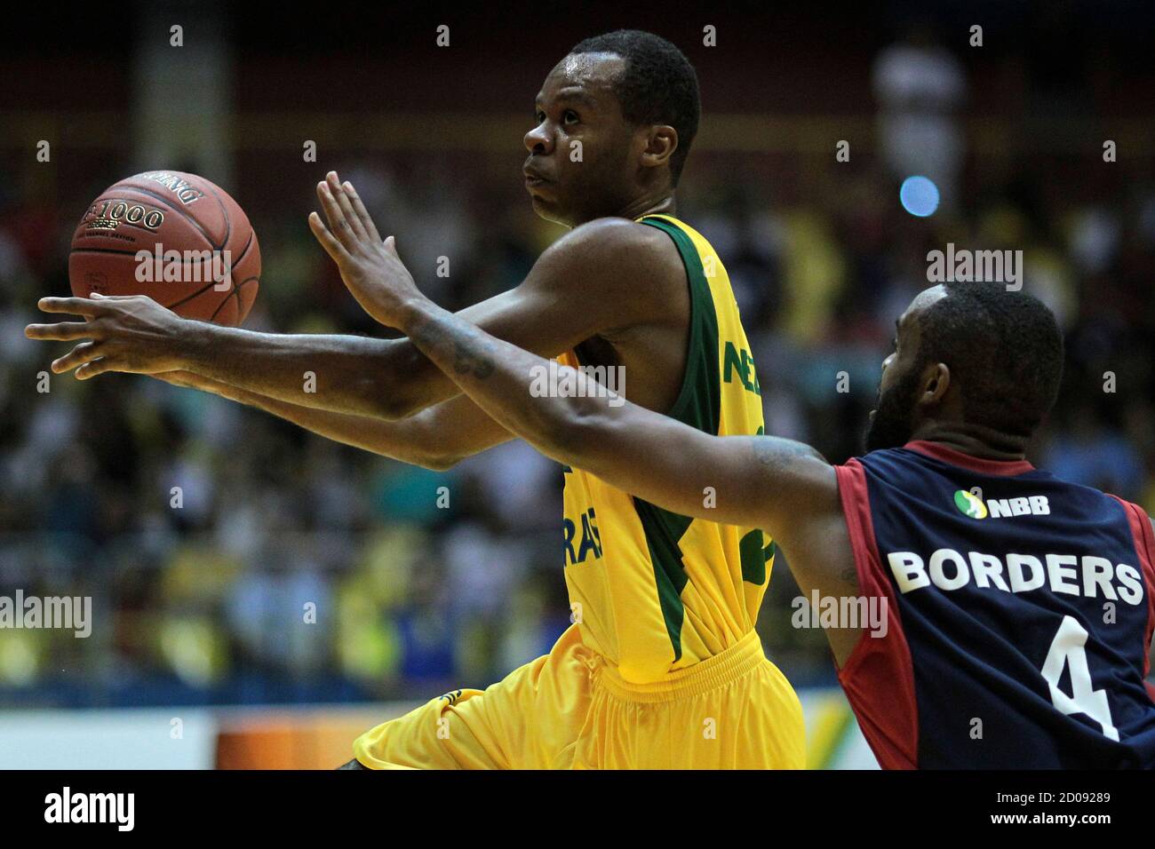 Nezinho (back) of NBB Brazil fights for the ball with Mark Antonio Borders  of NBB World during the Novo Basquete Brasil (NBB) All-Star basketball game  at Nilson Nelson gym in Brasilia March