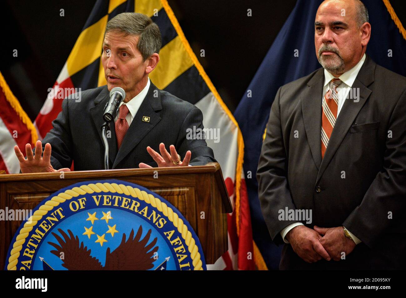 Acting Secretary of Veterans Affairs Sloan Gibson (L) is joined by