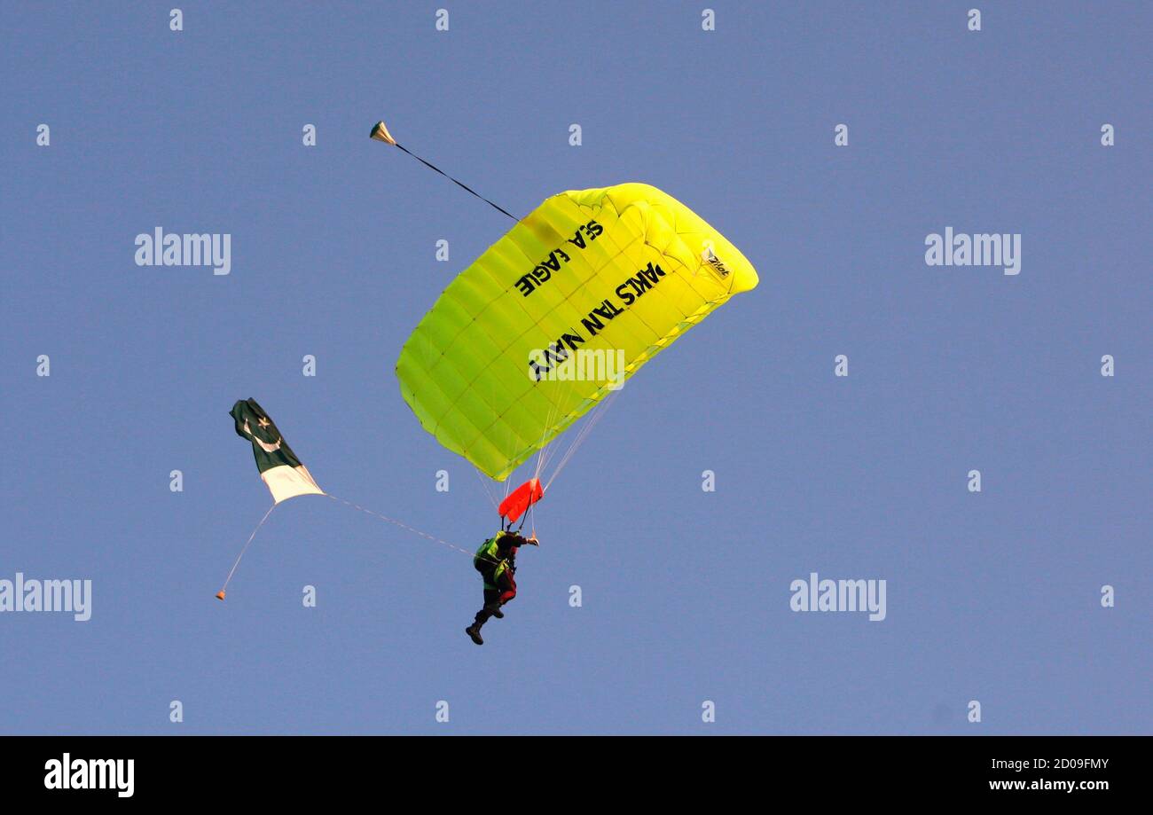 A member of Pakistan Navy special forces parachutes during a counter