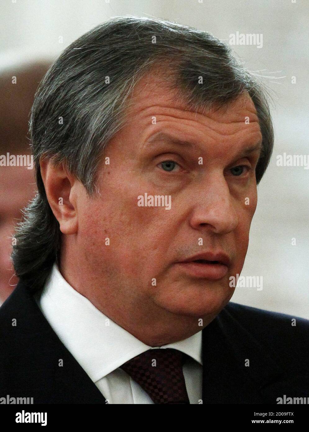 Rosneft President and Chairman of the Management Board Igor Sechin attends a meeting of Russia's President Vladimir Putin and his Chinese counterpart Xi Jinping at the Kremlin in Moscow March 22, 2013. Shares in TNK-BP Holding, the traded unit of TNK-BP oil producer, fell more than 14 percent to reach its historic low on Friday after Igor Sechin, the head of Rosneft, reiterated that Rosneft will not buy out TNK-BP shares. REUTERS/Sergei Karpukhin (RUSSIA - Tags: POLITICS BUSINESS ENERGY HEADSHOT) Stock Photo