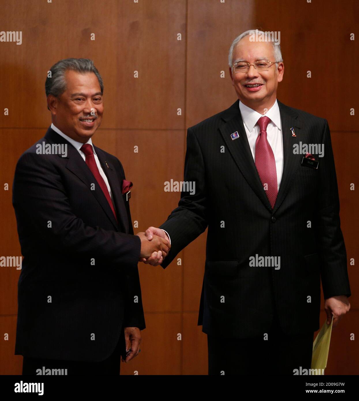 Malaysia S Prime Minister Najib Razak R Shakes Hands With Deputy Prime Minister Muhyiddin Yassin After The Announcement Of His New Cabinet Ministers Lineup At His Office In Putrajaya Outside Kuala Lumpur May