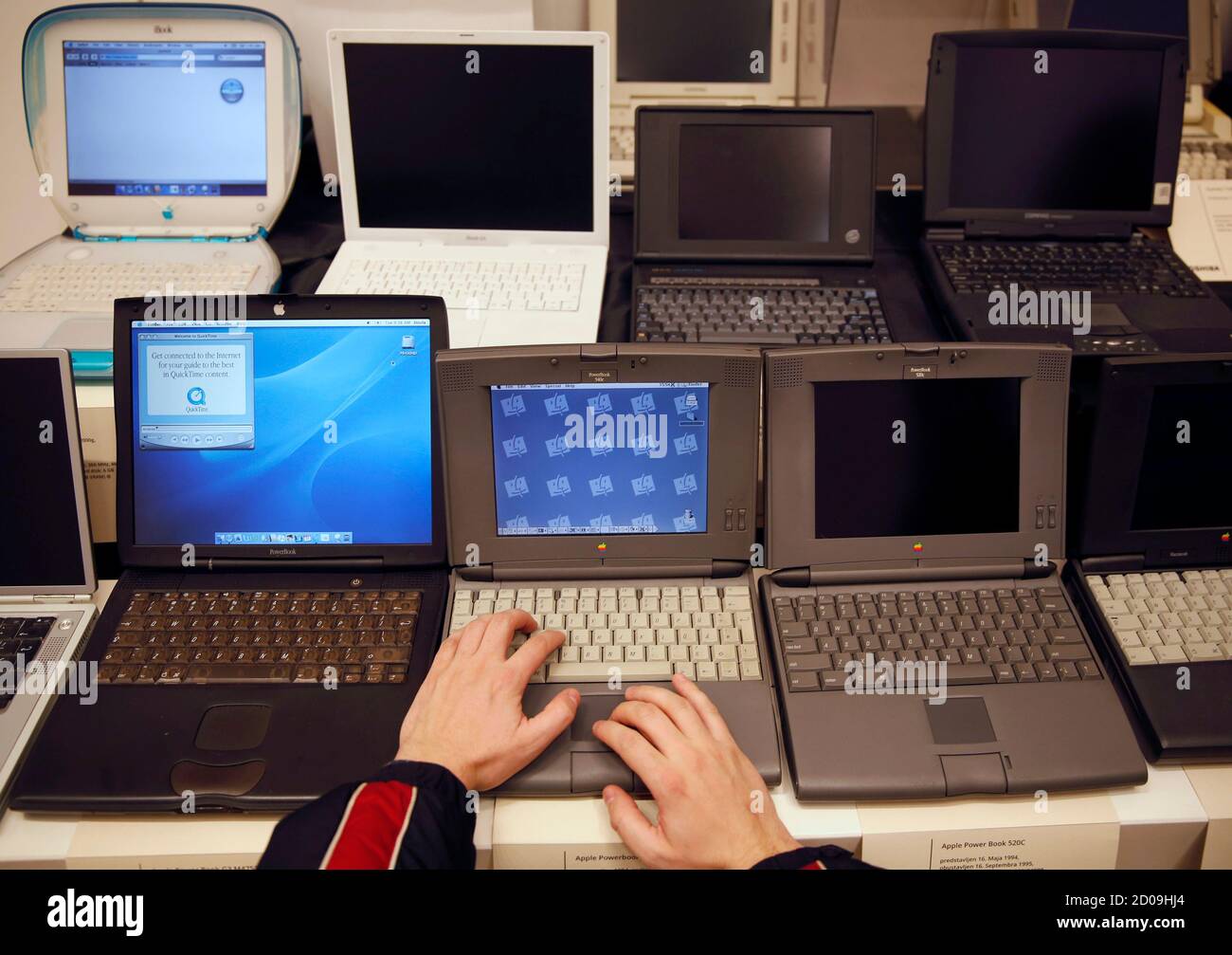 A man works on an Apple PowerBook 540c laptop during the "History of  Computers" exhibition in Sarajevo November 30, 2013. 110 computers from the  1970s to 2008 are displayed during the exhibition,