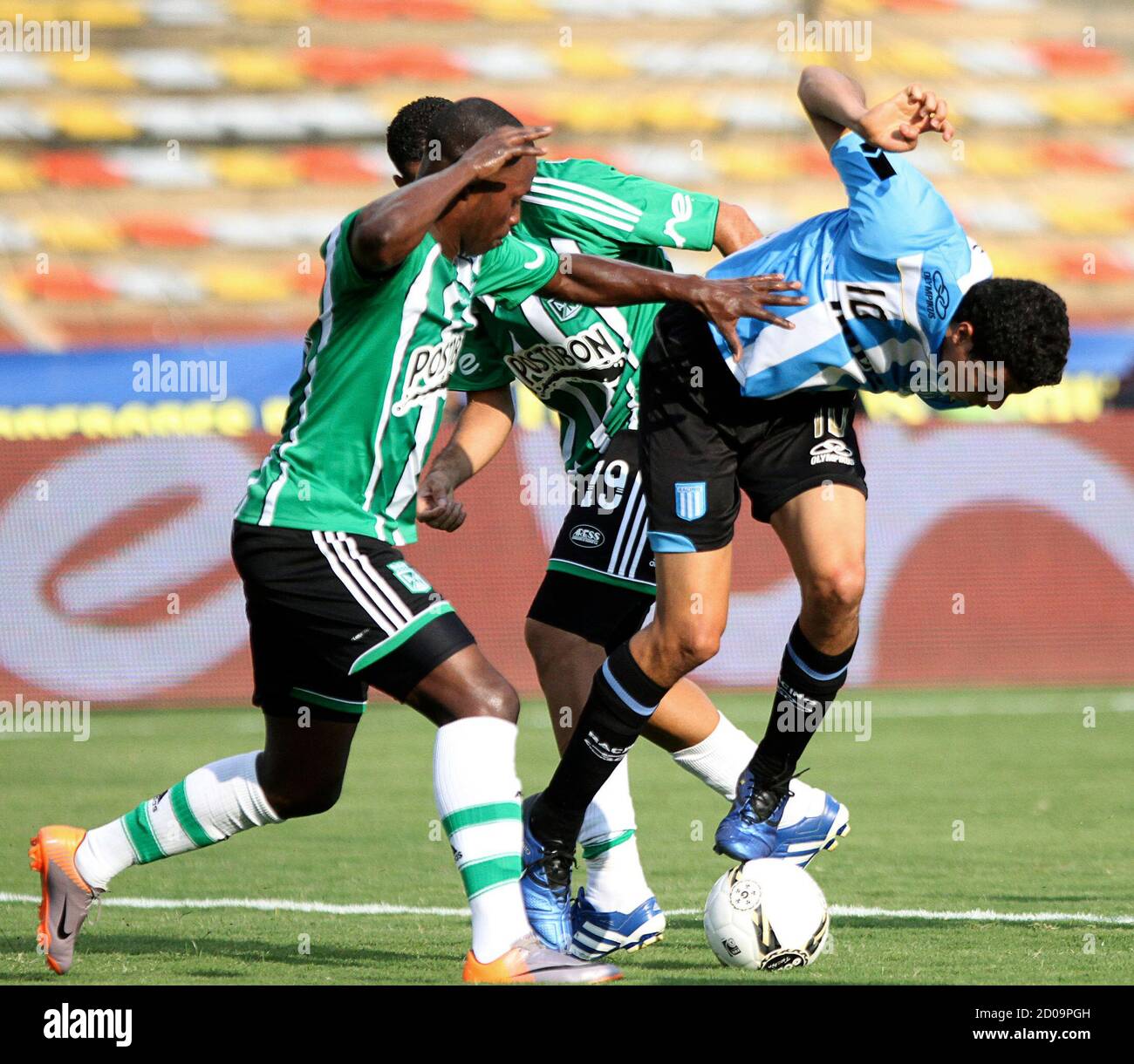 Giovanni Moreno (R) of Argentina's Racing Club fights for the ball with  Carlos Renteria of Colombia's Atletico Nacional during their friendly  football match at Atanasio Girardot stadium in Medellin January 30, 2011.