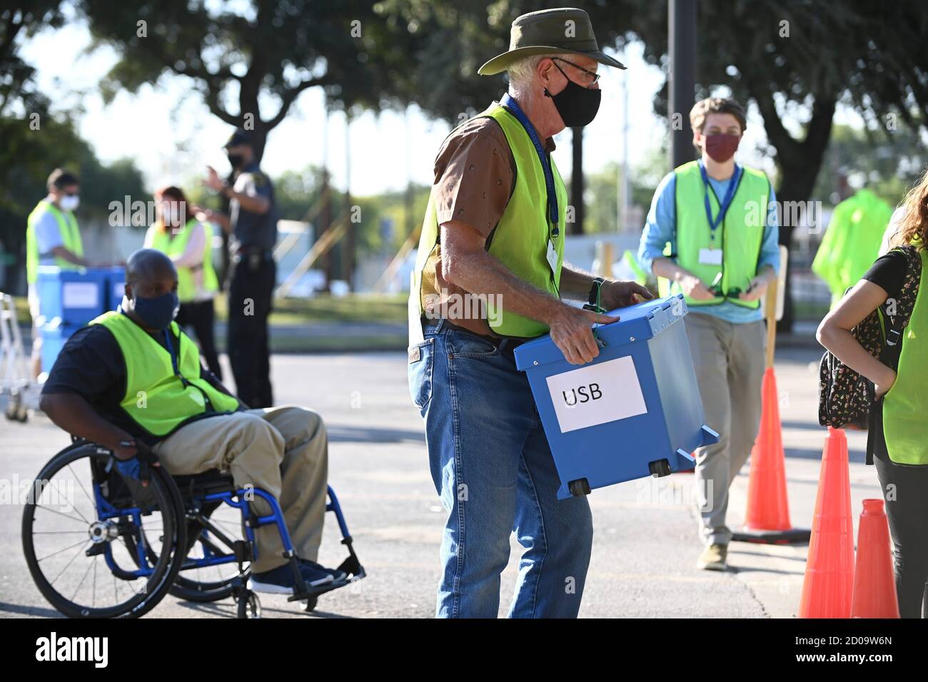 Austin, Texas, USA. 2nd Oct 2020. Travis County elections officials collect boxes with mail-in ballots dropped off by voters in person as voting starts in Texas for the contentious presidential contest as well as other races. Credit: Bob Daemmrich/Alamy Live News Stock Photo